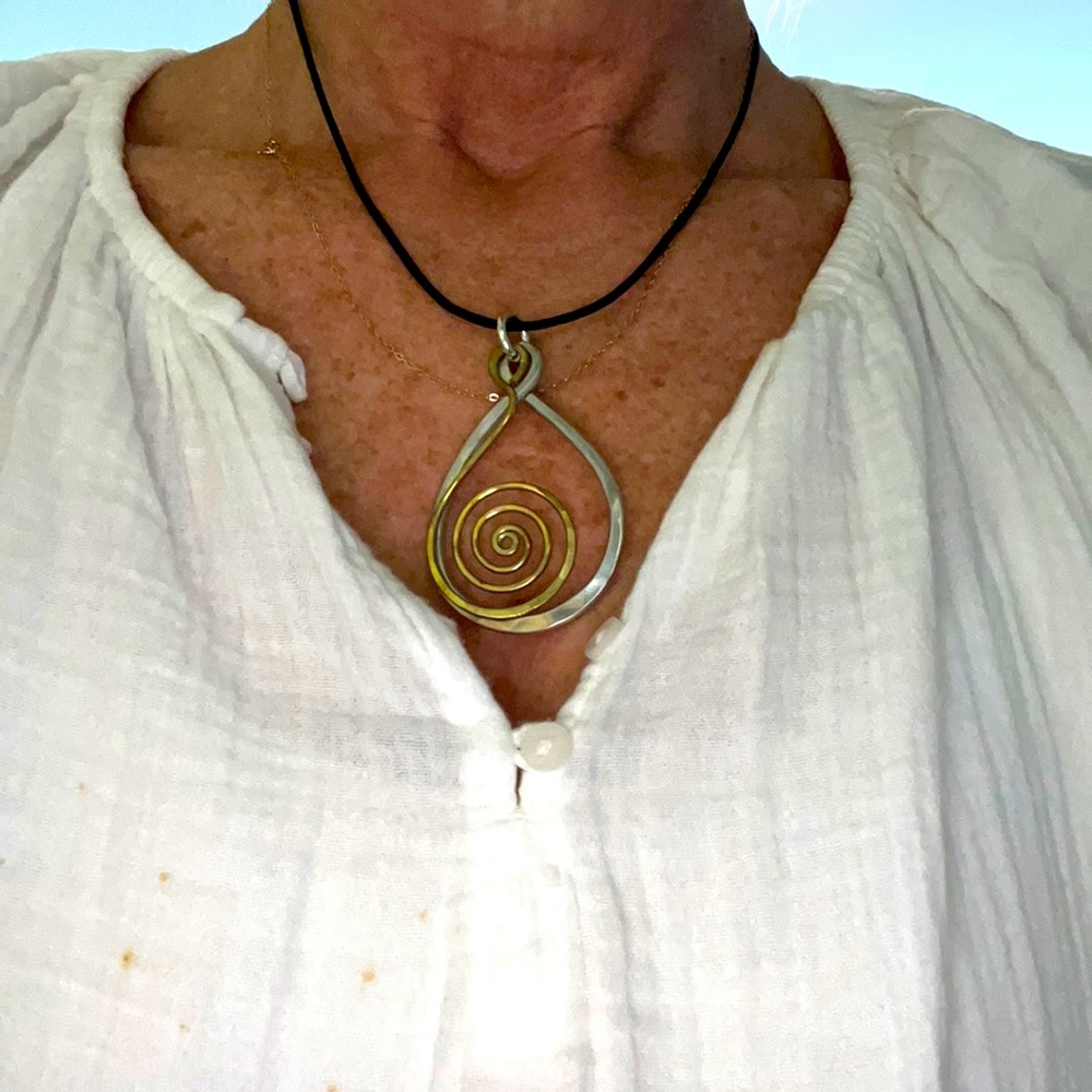 Hand hammered metal necklace with leather neck chain never worn